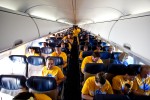 Southwest employees, family members, and media guests seat themselves prior to the flight.